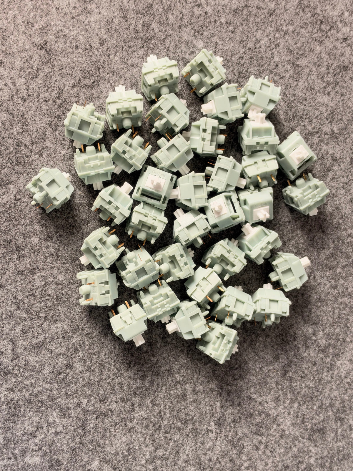 OZO Keyboards OwLab London Fog linear mechanical keyboard switches with pale green polycarbonate housings