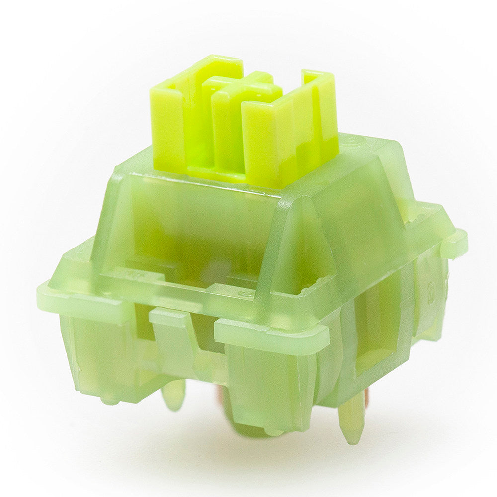 Green mechanical keyboard switch on a white background