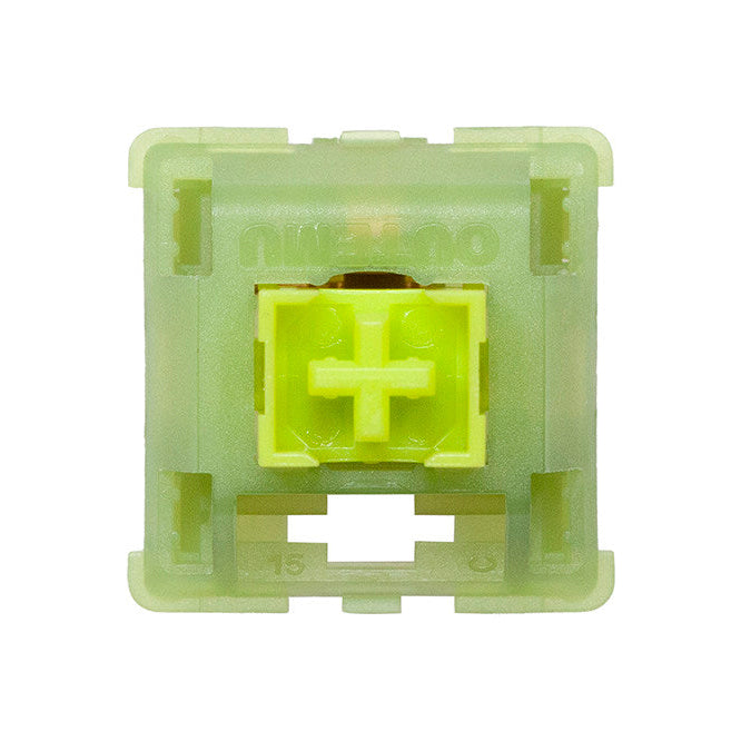 Green mechanical keyboard switch on a white background