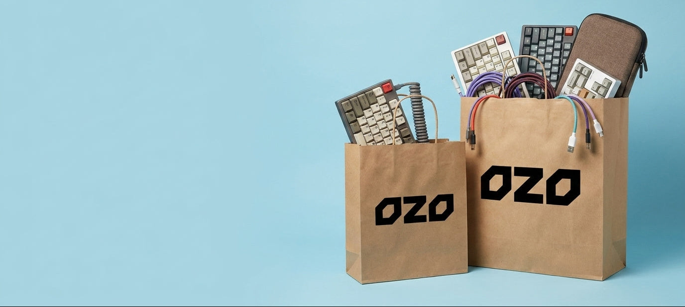 Two brown paper bags labeled 'OZO' filled with electronic devices on a light blue background