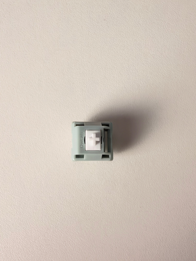 OZO Keyboards OwLab London Fog linear mechanical switch with a grey polycarbonate housing and white UPE long-pole stem