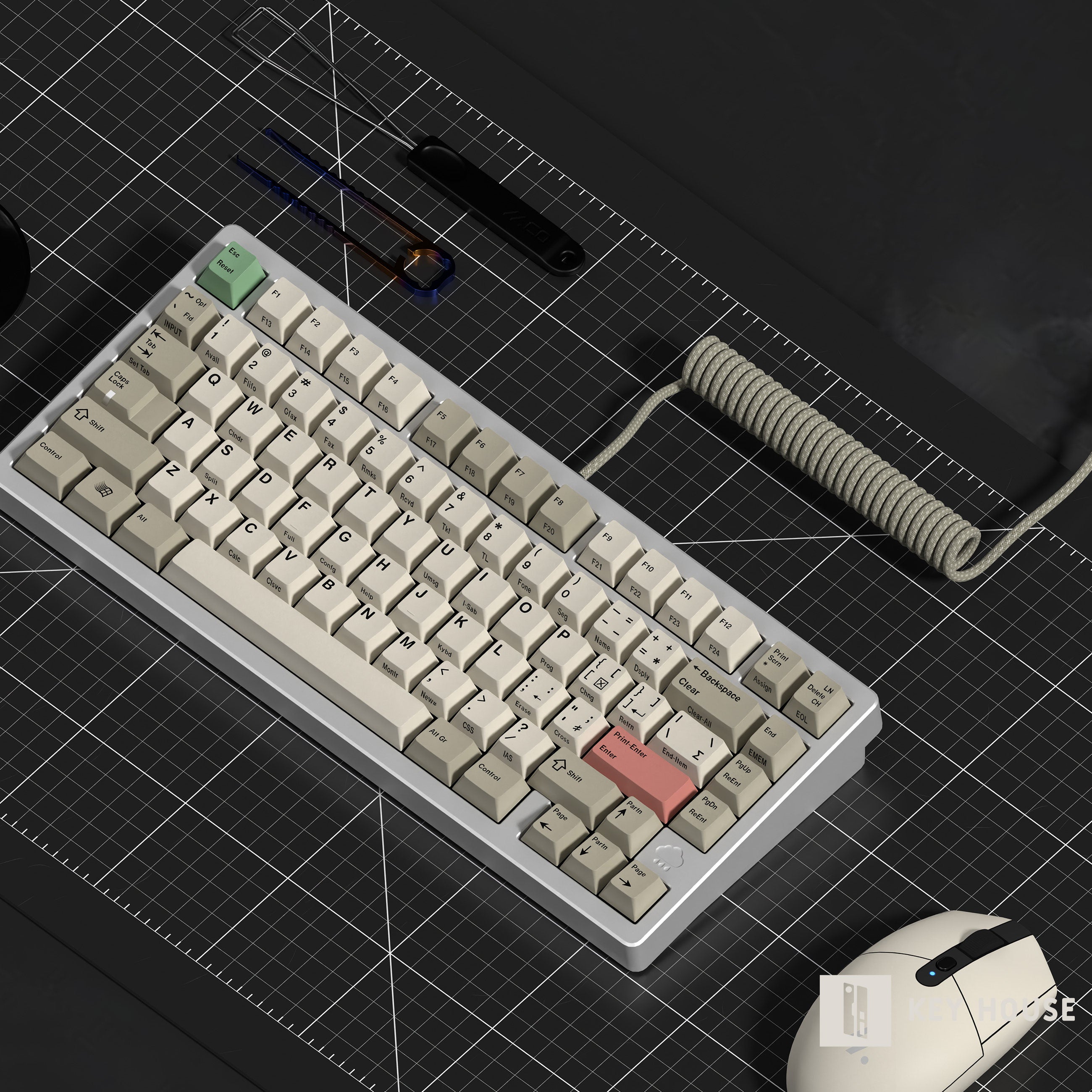 Mechanical keyboard with a coiled cable on a grid surface