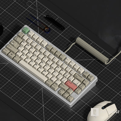 Mechanical keyboard with a coiled cable on a grid surface