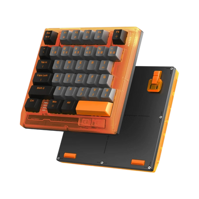 HK35 one handed magnetic keyboard, Competition Orange translucent case with black and grey keycaps, angled view with bottom plate 
