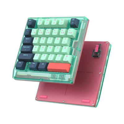HK35 one handed magnetic keyboard, Rebecca mint case with mint and navy keycaps and pink bottom plate, angled view 