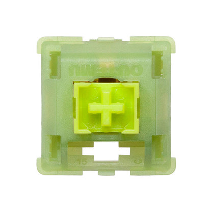 Green mechanical keyboard switch on a white background