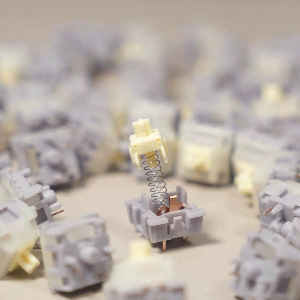 OZO Keyboards SU LAB Moonlight silent tactile mechanical keyboard switch with a cream stem and grey housing