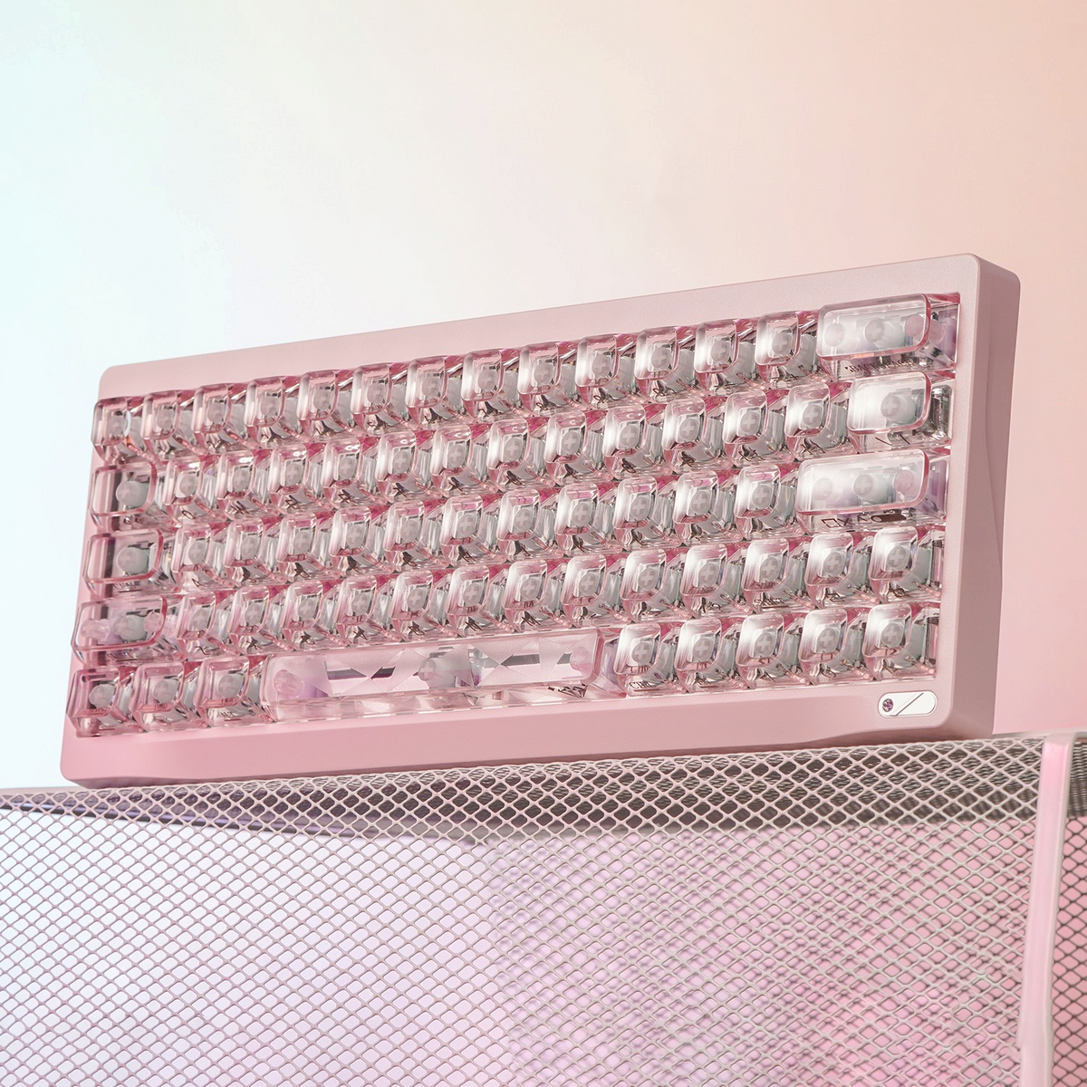 OZO Keyboards SF60 Diamond Edition pink mechanical keyboard with transparent crystal-style keycaps on mesh stand