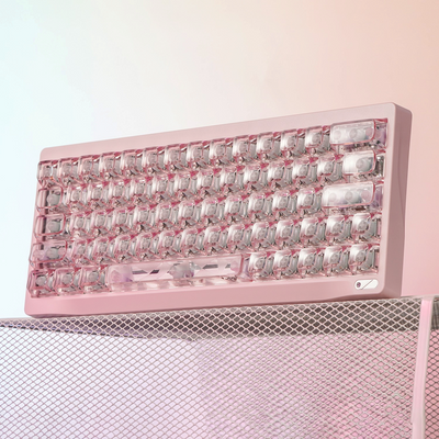 OZO Keyboards SF60 Diamond Edition pink mechanical keyboard with transparent crystal-style keycaps on mesh stand