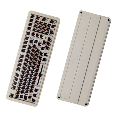 OZO Keyboards Story100 barebone 100% mechanical keyboard with a beige aluminum case and copper-colored switch plate