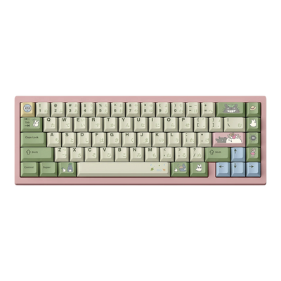 Totoro keycap set with Japanese hiragana legends in green and cream on a pink 65% keyboard, front view