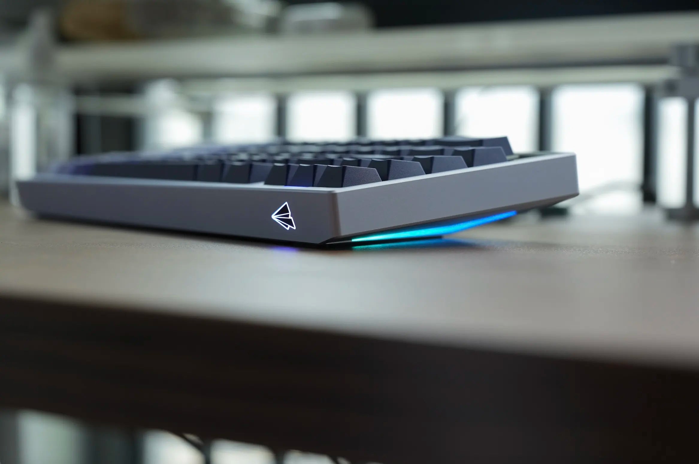 Mechanical keyboard with blue backlight on a desk