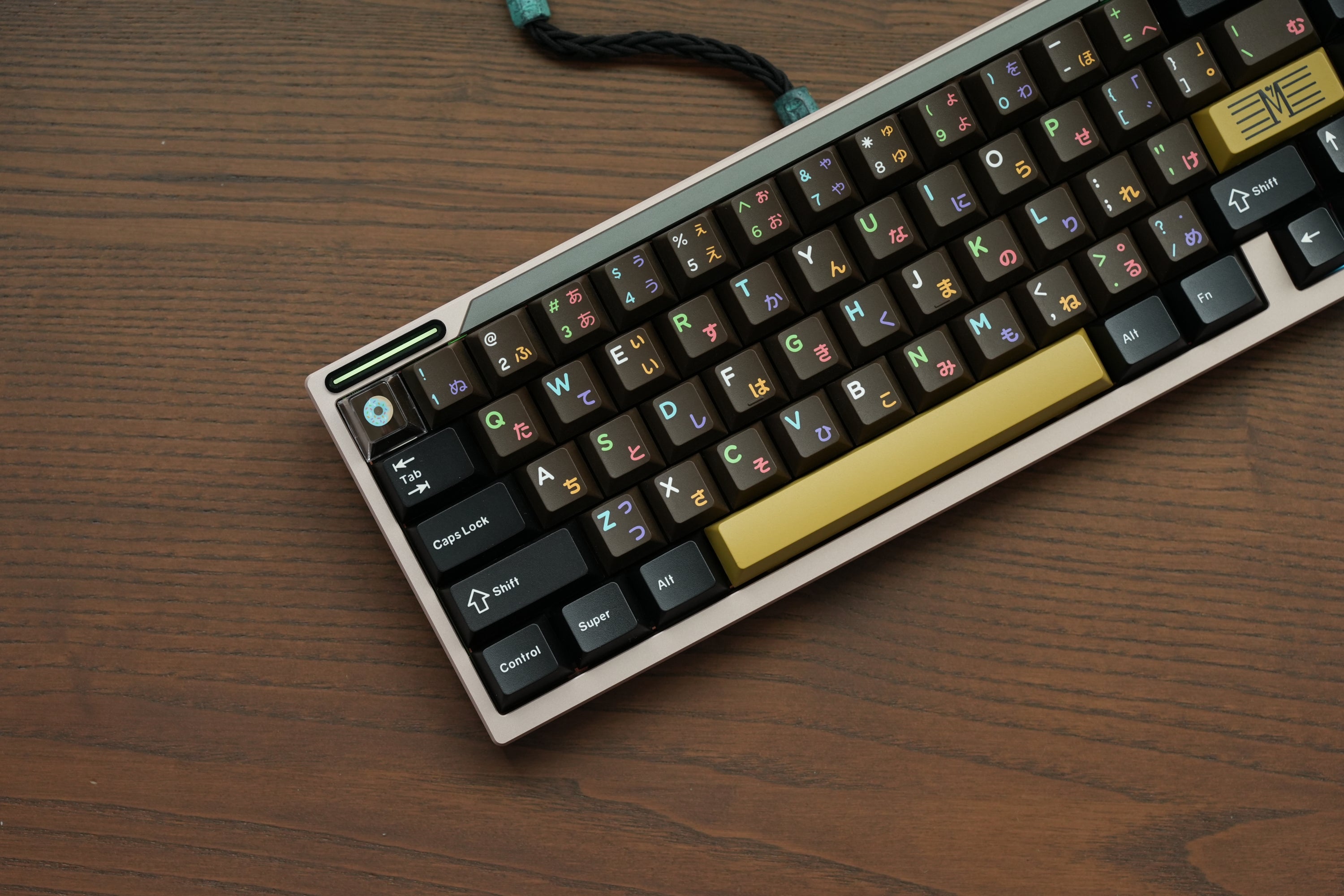 Keyboard with colorful keys on a wooden surface