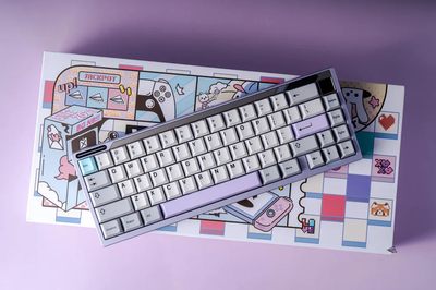 Paper 65 mechanical keyboard in rogue violet case colour on a colourful graphic design background